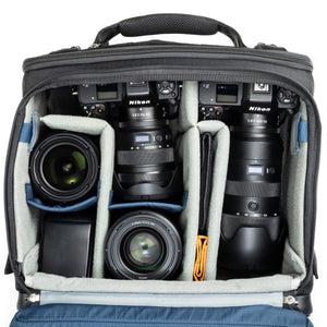 2 gripped camera bodies with lenses attached, 1-2 additional lenses, and/or two flashes